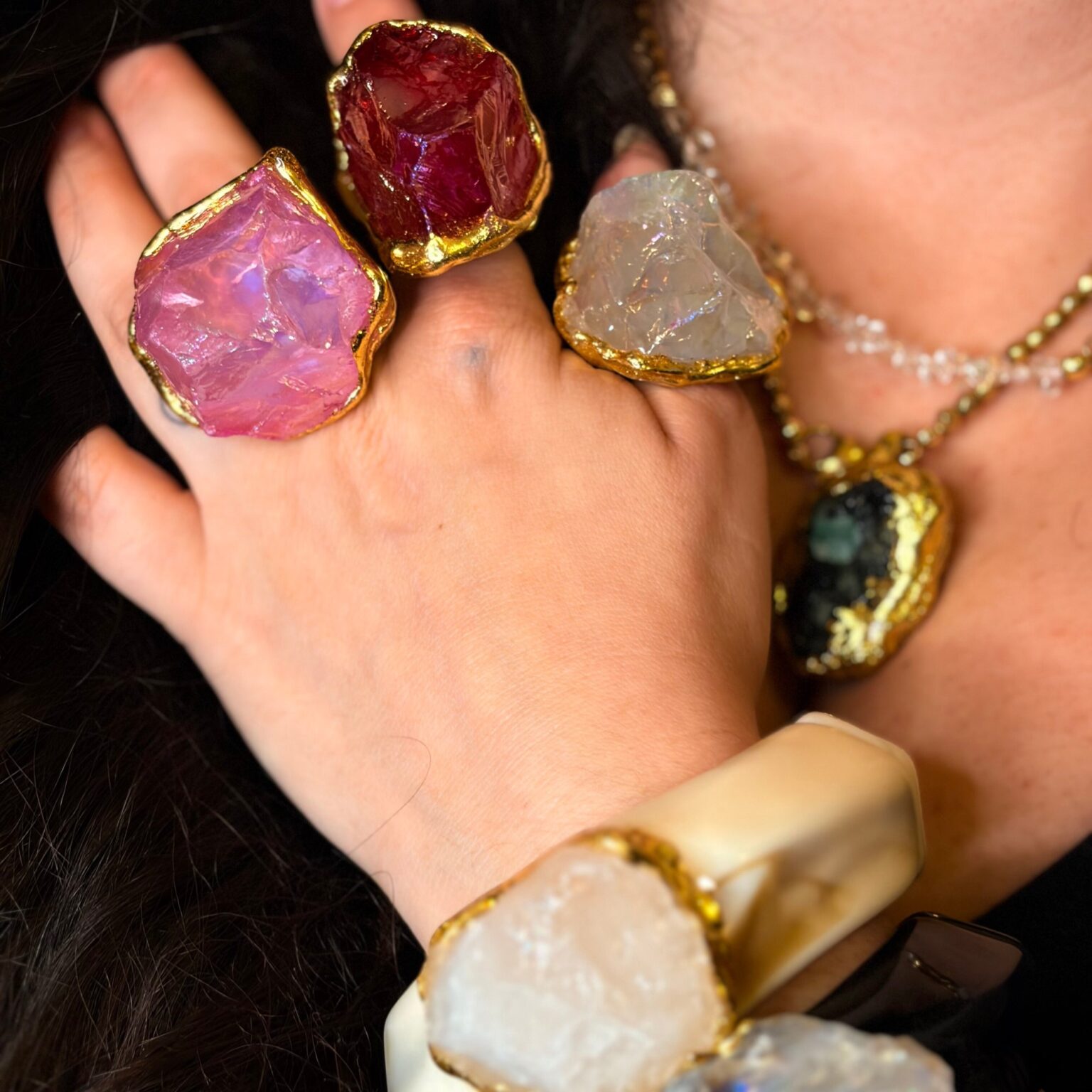 Hands wearing Inkandelas rings and a bracelet